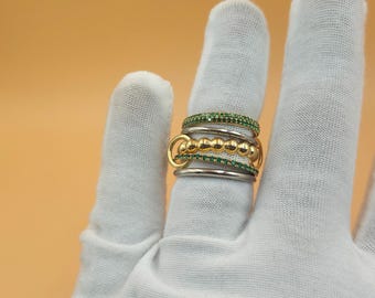 Anello in argento sterling bicolore con maglie multiple e design a cinque fasce intrecciate.