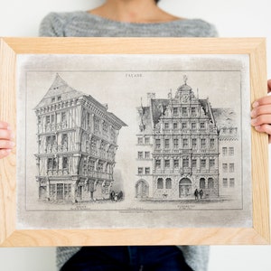 May include: A framed black and white print of two historical building facades. The print is titled "Facade" and features two buildings with intricate details. The buildings are labeled "Bremen" and "Freiburg".