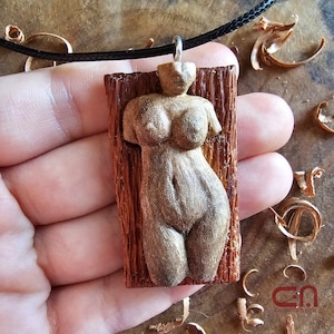 Naked female body necklace. Pendant hand carved in walnut wood (the body) and mahogany wood (the back base).