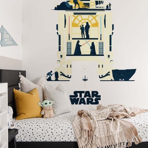 May include: A Star Wars themed bedroom featuring a large wall decal of R2-D2 with iconic characters and scenes. The bed has a patterned comforter, pillows, and a tan fringed throw. A small Grogu plushie sits on the bed.