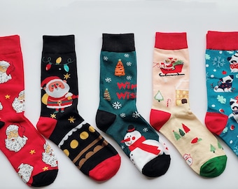May include: Six pairs of colorful Christmas themed socks with various designs including Santa Claus, a snowman, a Christmas tree, and a reindeer.