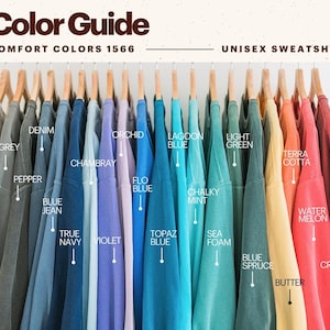 May include: A color guide for unisex sweatshirts in various shades, including grey, denim, blue jean, violet, lagoon blue, and light green. The image displays the color options with labels like "White," "Pepper," and "Butter."
