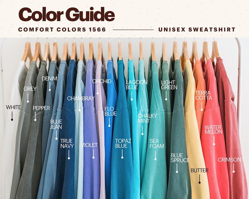 May include: A color guide for unisex sweatshirts in various shades, including grey, denim, blue jean, violet, lagoon blue, and light green. The image displays the color options with labels like "White," "Pepper," and "Butter."