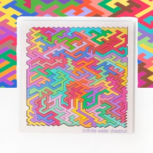 May include: Square coaster with a colorful geometric maze design in shades of pink, green, blue, orange, and purple. The text "Infinite water chestnut" is printed at the bottom.