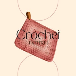 May include: A square, crocheted potholder in shades of pink, with a leather loop for hanging. The word "Crochet" is written in a stylish font, with "PATTERN" below it. The potholder has a textured design.