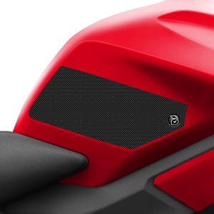 May include: Black motorcycle tank protectors with a honeycomb pattern and a small logo. The protectors are designed to protect the tank from scratches and scuffs.