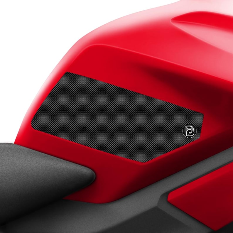 May include: Black motorcycle tank protectors with a honeycomb pattern and a small logo. The protectors are designed to protect the tank from scratches and scuffs.
