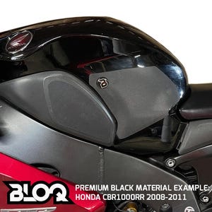 May include: Black motorcycle tank pads with a honeycomb pattern. The pads are installed on a black Honda CBR1000RR motorcycle. The text "PREMIUM BLACK MATERIAL EXAMPLE: HONDA CBR1000RR 2008-2011" is visible at the bottom of the image.