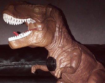 Dinosaur Projector and room guard T Rex toy.