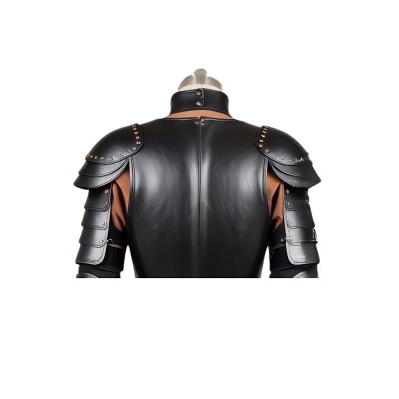 May include: Black leather armor with studded shoulder pads. The armor is designed to resemble a medieval knight's armor.