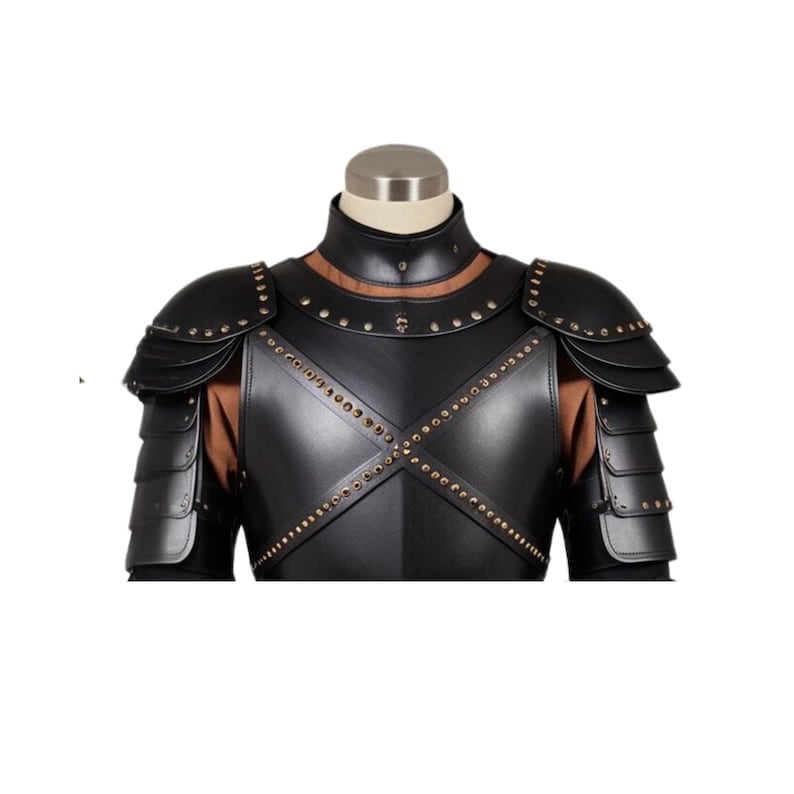 May include: Black leather armor with gold studs. The armor has a chest plate and shoulder pads.