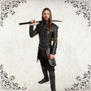 May include: A man wearing a black leather armor with a sword strapped to his back. He is wearing black pants and boots.