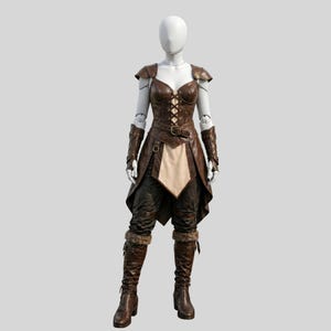 May include: A brown leather fantasy costume displayed on a mannequin. The outfit includes a corset, shoulder pads, arm guards, pants, and boots. The corset has a lace-up front and a belt. The pants have a unique design, and the boots have fur trim.