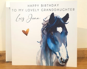 May include: A white card with blue and white watercolor painting of a horse's head. The card says "Happy Birthday to my lovely granddaughter Lois Jean" with a small gold heart.