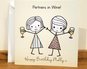 May include: A birthday card with a cartoon illustration of two friends raising a glass of wine. The card reads "Partners in Wine!" and "Happy Birthday Molly x".