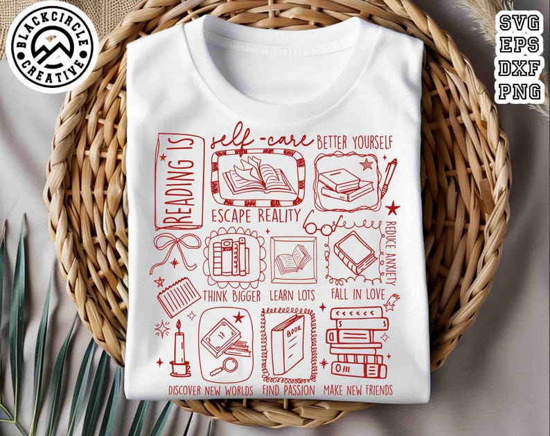 May include: White t-shirt with a red graphic design featuring book-related illustrations and text. The design includes phrases like "Reading is," "Self-care," and "Escape Reality." The shirt is displayed on a woven basket.