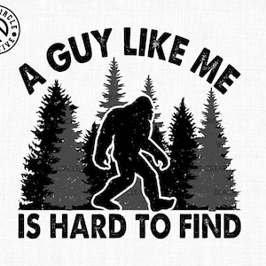 May include: Black and white graphic featuring a Bigfoot silhouette walking in front of pine trees. The text reads "A GUY LIKE ME IS HARD TO FIND" in a bold, distressed font. The Black Circle Creative logo is in the upper left corner.