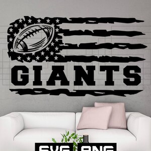 May include: Black and white graphic of an American flag with a football in place of the stars and the word "GIANTS" below. The design is distressed, with a grunge effect. The image includes "SVG" and "PNG" file type icons.