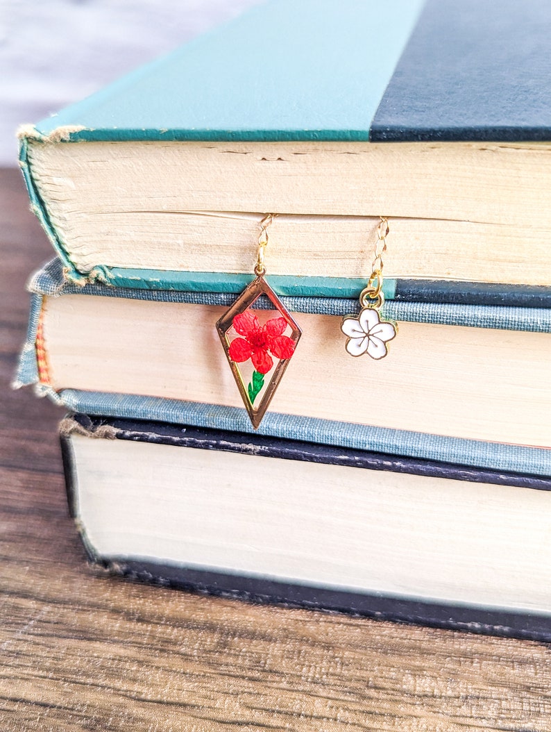 Red dried pressed flower resin charm bookmark.