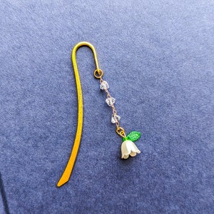 Flower charm beaded metal bookmark.