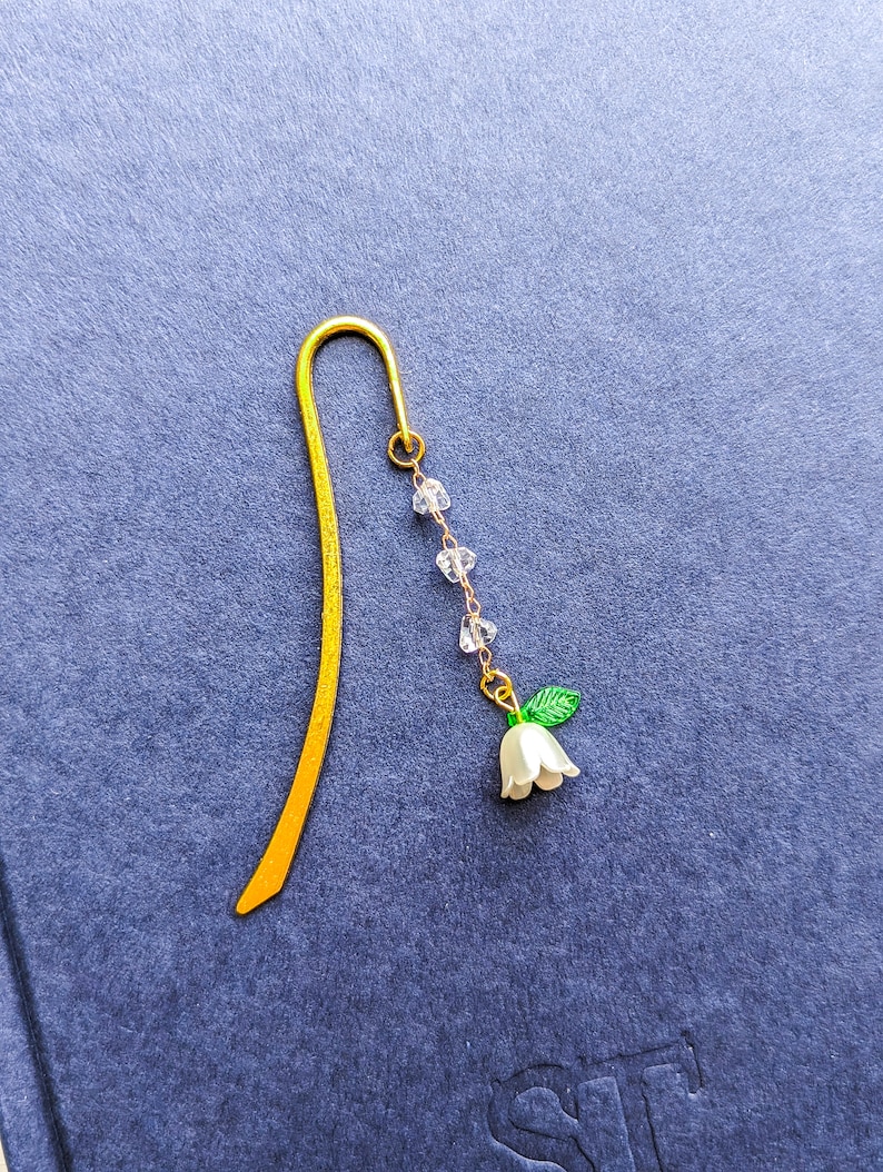 Flower charm beaded metal bookmark.