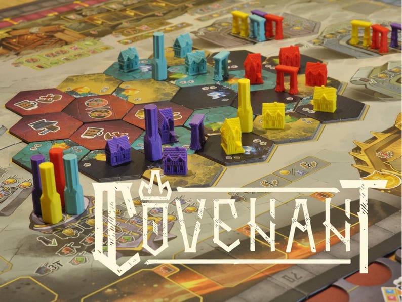 May include: A board game with a hexagonal game board and colorful miniature buildings and structures. The game pieces are in shades of blue, red, yellow, and purple. The game board has a variety of terrain tiles and the word "COVENANT" is displayed in white.