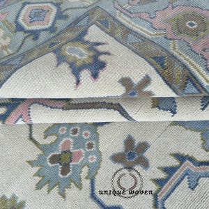 Handmade Wool Oushak Rug: Blue Border, Ivory Accent, Turkish Knots