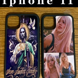 May include: Two black iPhone 11 cases. One case features a colorful image of a religious figure with the text "San Judas Tadeo". The other case features a collage of three images of a woman with pink hair.