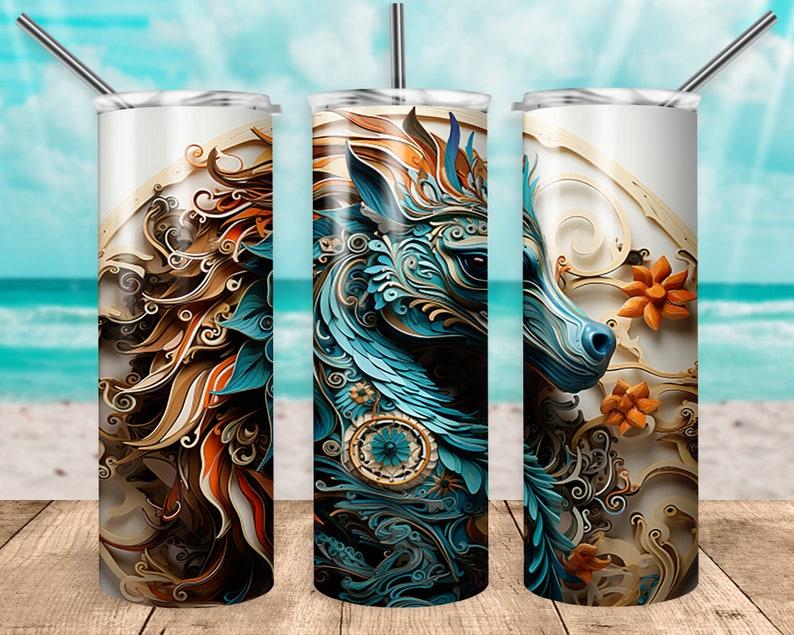May include: A stainless steel tumbler with a colorful, abstract design featuring a blue and gold animal head with intricate details. The design is reminiscent of paper cutouts.