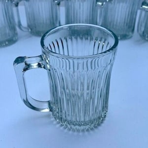 2 Pieces Clear Glass Coffee Mugs with Glass Lids Vintage Vertical Stripes  Tea Mug Classic Ribbed Gla…See more 2 Pieces Clear Glass Coffee Mugs with