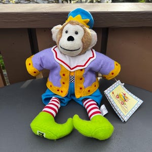Mary Engelbreit JoJo the Monkey. Dressed as a Clown. Original tag attached. 12 inches. Excellent condition.