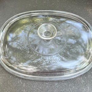 Pyrex tempered glass lid, DC 1 1/2 C, Measures 11 x 8 1/2 rectanglular shape.