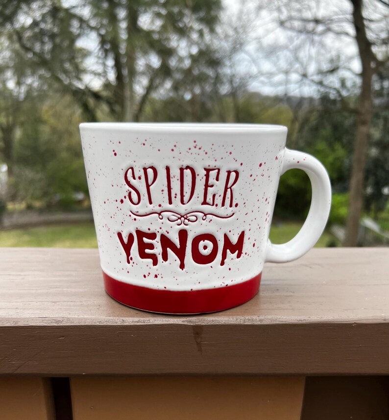 May include: A set of three ceramic nesting bowls in shades of blue, green, and white. The bowls feature a speckled glaze and a simple, modern design. The largest bowl measures approximately 6 inches in diameter.