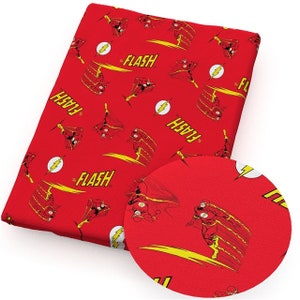 May include: Red fabric featuring a repeating pattern of The Flash. The design includes images of the superhero in action, the Flash logo, and the word "FLASH" in yellow. The fabric is suitable for various crafting and sewing projects.