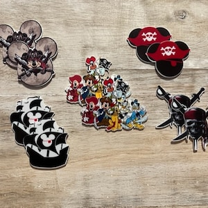 May include: A set of 10 colorful Disney character iron-on patches featuring Mickey Mouse, Minnie Mouse, Donald Duck, Goofy, Pluto, and other characters. The patches are perfect for adding a touch of Disney magic to clothing, bags, and other accessories.