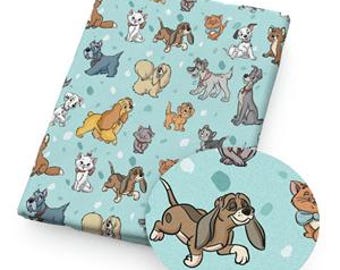 May include: A folded fabric piece with a light blue background featuring cartoon dogs and cats in various poses. The fabric has a repeating pattern of different breeds and feline characters, with a close-up circle showing a running dog.