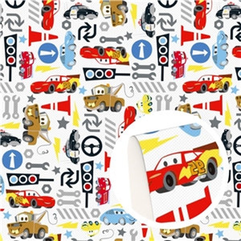 May include: White fabric with a repeating pattern of cartoon cars, traffic lights, wrenches, and directional signs in red, yellow, blue, and black. The cars have racing stripes and various designs.