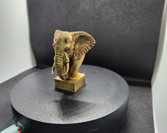 Busto de elefante en bronce bruñido