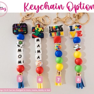 May include: Four colorful beaded keychain options with different charms. The charms include a puzzle piece, a heart with "I Love Spreading Autism Awareness" text, a heart with "LOVE" text, and a heart with "AUTISM" text. The keychains are made with colorful beads and have a tassel at the bottom.