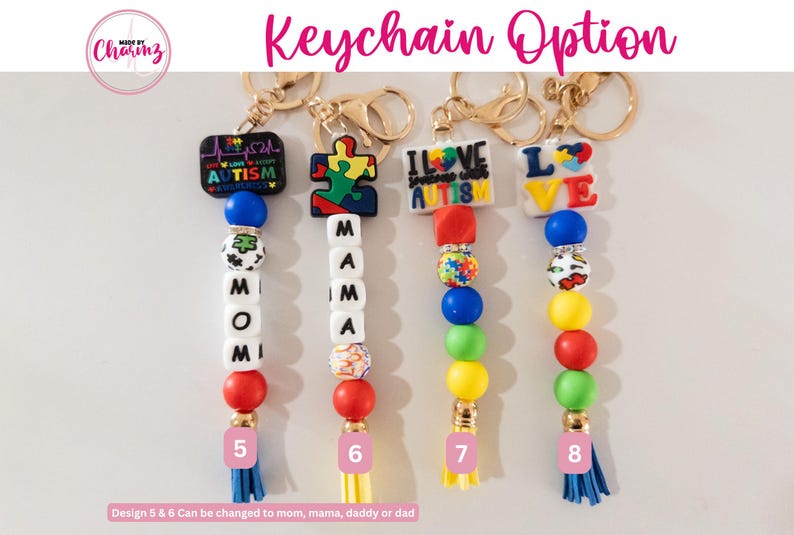 May include: Four colorful beaded keychain options with different charms. The charms include a puzzle piece, a heart with "I Love Spreading Autism Awareness" text, a heart with "LOVE" text, and a heart with "AUTISM" text. The keychains are made with colorful beads and have a tassel at the bottom.