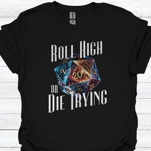 May include: Black t-shirt with a graphic of a 20-sided die and the text "Roll High or Die Trying".