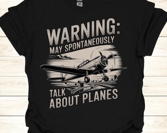 May include: Black t-shirt with a vintage airplane graphic and the text "WARNING: MAY SPONTANEOUSLY TALK ABOUT PLANES".