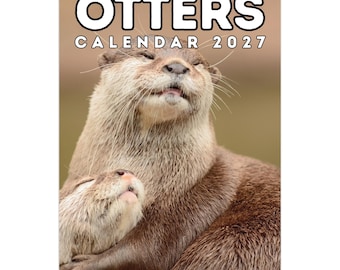 May include: A wall calendar featuring a photograph of two brown otters embracing with their eyes closed. The top of the calendar displays the text OTTERS CALENDAR 2027 in bold white letters with a black outline against a soft brown background.