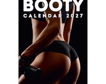 May include: A wall calendar titled BOOTY CALENDAR 2027 featuring a photograph of a person in black athletic wear holding a dumbbell. The calendar is spiral-bound at the top and displays the text in bold white letters against a black background.