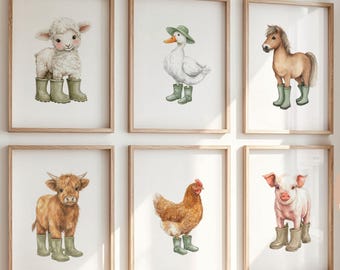 May include: Six framed wall art prints featuring watercolor illustrations of a lamb, a duck, a horse, a highland cow, a chicken, and a piglet. Each animal is wearing green rubber boots. The frames are light wood, and the prints have white backgrounds.