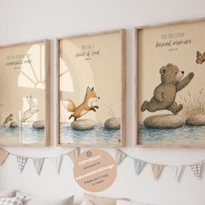 Könnte beinhalten: Drei gerahmte Wandbilder mit Illustrationen eines Frosches, eines Hasen, eines Fuchses und eines Bären, die über Steine im Wasser springen. Die Bilder enthalten den Text: You are fearfully and wonderfully made, You are a child of God und You are loved beyond measure.