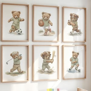 May include: A set of six framed wall art prints featuring brown teddy bears engaged in various sports including soccer, basketball, football, golf, baseball, and ice hockey. Each illustration depicts a bear in a uniform on a white background.