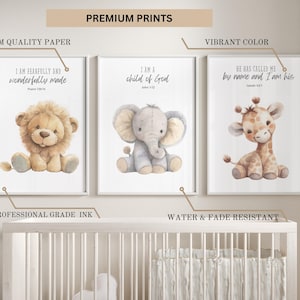 May include: Set of three nursery prints featuring watercolor illustrations of a lion, elephant, and giraffe. Each print includes a bible verse: "I am fearfully and wonderfully made", "I am a child of God", and "He has called me by name and I am his".