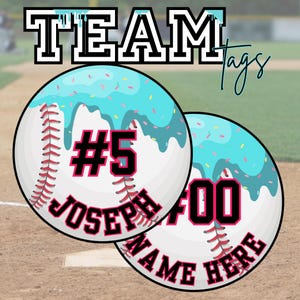 May include: Two baseball-themed tags with a light blue icing design and sprinkles. One tag has the number 5 and the name "JOSEPH", the other has the number 00 and the text "NAME HERE". The word "TEAM" is at the top.