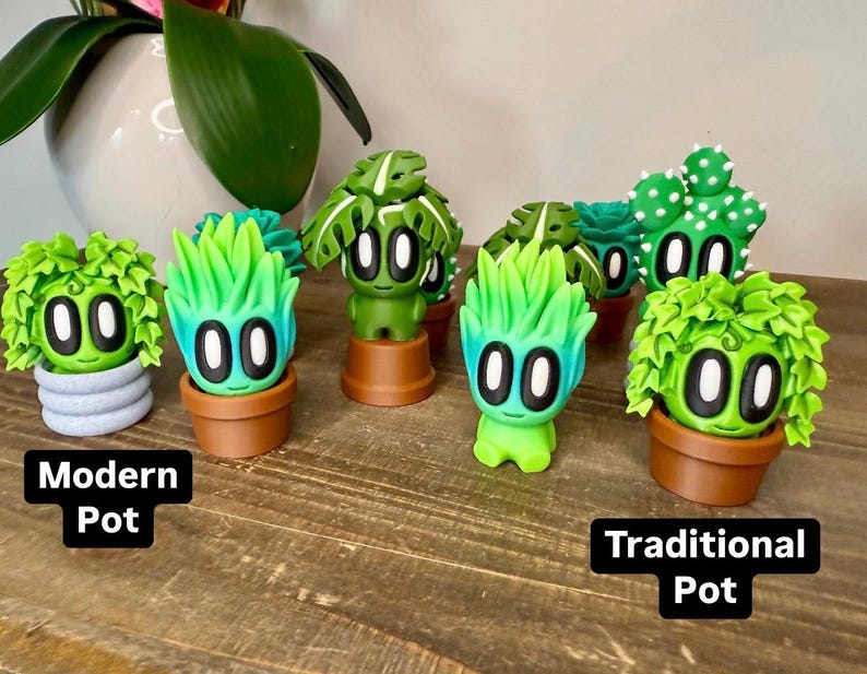 K&ouml;nnte beinhalten: Acht kleine gr&uuml;ne und blaue Pflanzenfiguren mit verschiedenen Gesichtsausdr&uuml;cken und Topfformen. Einige T&ouml;pfe sind modern und andere traditionell.